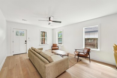 Living area featuring baseboards, visible vents, 