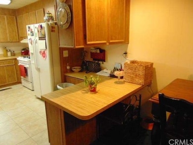 Kitchen has Eating Bar and is Open to the Dining A