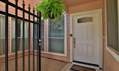 A gated front entrance is protected from the eleme