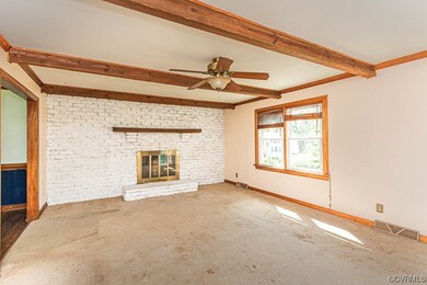 Living room with wood burning fireplace