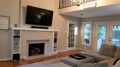 Great room with vaulted ceiling, catwalk, gas fire