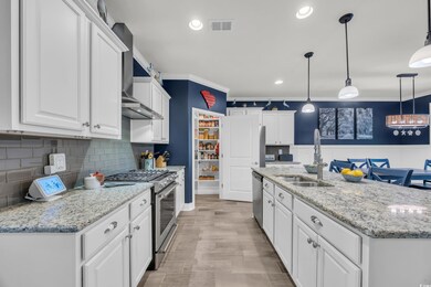 Kitchen featuring appliances with stainless steel 