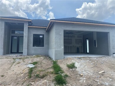 View of front of property featuring a garage, stuc