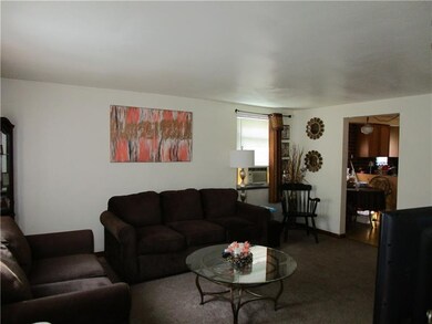 Unit #1 Living Room, with view of Eat-In Kitchen