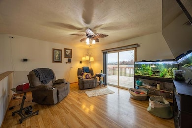 Living room with large deck overlooking the private backyard.