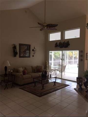Living Room, High Volume Ceilings, Transom Windows