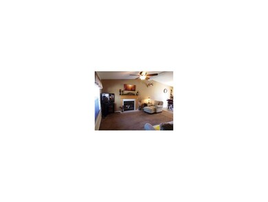 Living room has wood burning fireplace