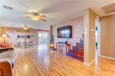 LIVING ROOM WITH ATTENTION GRABBING FAUX BRICK WAL