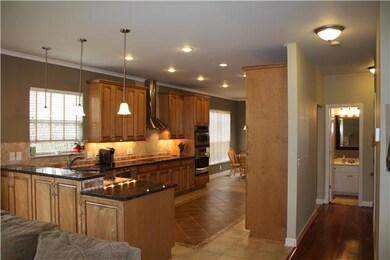 Complete kitchen remodel.  New custom cabinets, granite counters, recessed lighting, custom tile floor, and stainless appliances