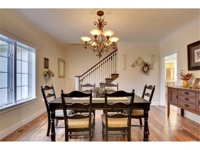 Spacious formal dining room with gleaming wood flo