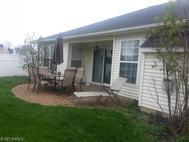 Private backyard oasis with brick patio, PVC priva