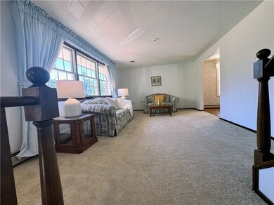 HUGE living room w neutral carpeting