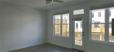 Doorway to outside featuring dark wood-style floor