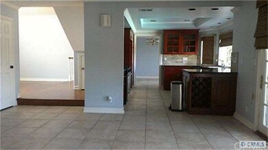 View from family room to kitchen to living room en