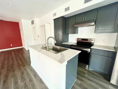Kitchen island, stainless steel appliances and sin