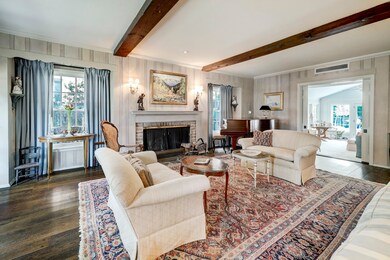 FORMAL LIVING ROOM (24’ X 16’)  with pocket doors leading to family room. Interiors by Jerry Jeanmard
Previous owner of Wells Design, Houston's prestigious interior design firm.