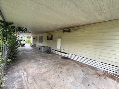 View of patio featuring a carport