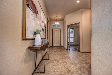 Entryway with stone finish floor, a textured wall,
