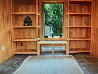 Rare heated large entry room has slate flooring; b