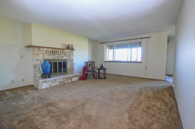 Living Room with Wood Burning Fireplace