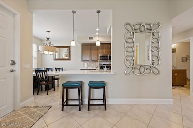 Kitchen with stainless steel microwave, tasteful b