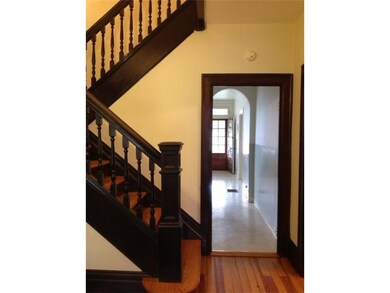 Entry/Foyer. Beautiful original woodwork is in gre