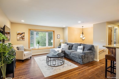 Living room opens to the dining and kitchen.
