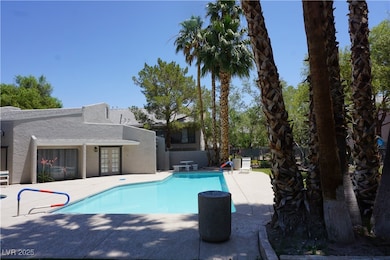 View of pool with a patio area and french doors