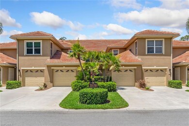 View of front of home with stucco siding, driveway