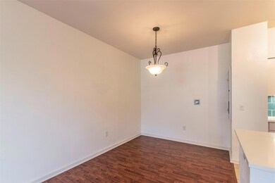 Unfurnished dining area with baseboards and wood 