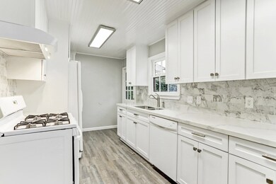 Recently renovated Kitchen boasts marble counters
