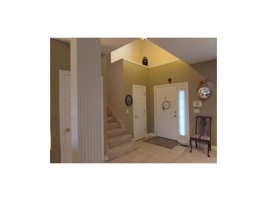 Elegant Entry with Ceramic Tile and accent shelf p