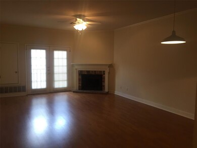 Unfurnished living room with ornamental molding, 
