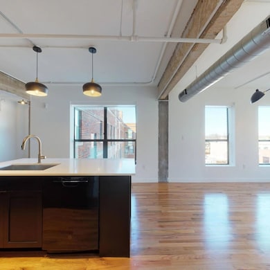 Kitchen with a wealth of natural light, sink, blac