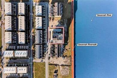 A sweeping aerial perspective reveals the property's enviable location near iconic landmarks, lush greenways, and the Talmadge Bridge-anchoring it within Savannah's most coveted riverfront corridor.