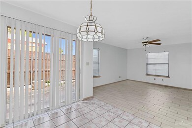Spare room with a ceiling fan and light wood finished floors