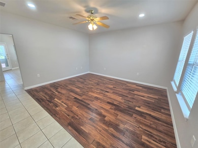 Unfurnished room with recessed lighting, wood finished floors, and ceiling fan