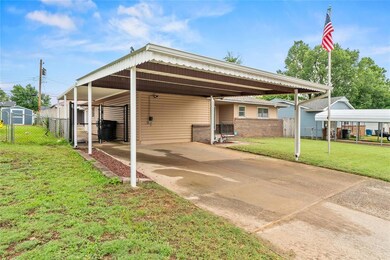 View of vehicle parking featuring a carport and concrete driveway
