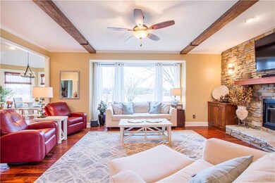 Family room with stone fireplace overlooking pond!