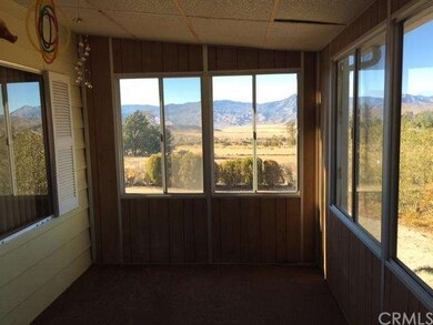 Enclosed front porch with view of the lake. 