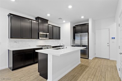 Kitchen with Island, Quartz Countertops & GE Monog