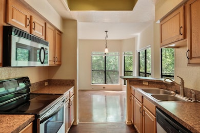 Kitchen featuring decorative light fixtures, stai