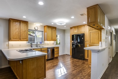 Thoughtful details in the kitchen make it a pleasure to gather and cook, while the rich luxury vinyl plank flooring offers style and easy care, flowing beautifully through the home.