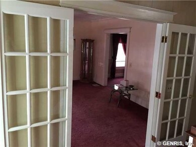 Living Room. Looking through French doors from foy