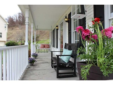 Exterior Front. Covered front porch with swing and