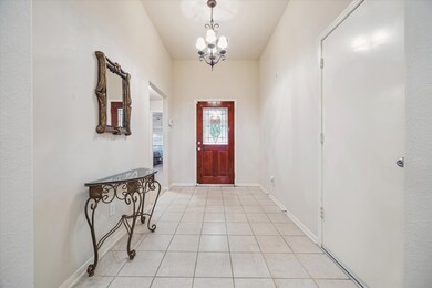 Inviting entryway featuring a wooden front door wi