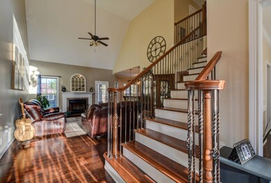 Large Entry Foyer with Hardwood Floors Throughout The Main Level - Tile in The Wet Areas