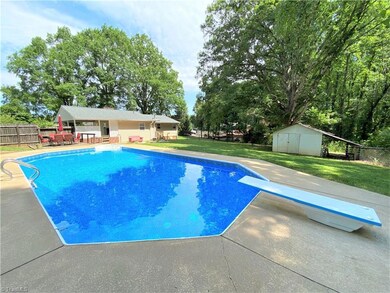 In ground pool in backyard