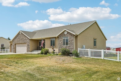 Ranch-style house with stone siding, a garage, concrete driveway, and a shingled roof
