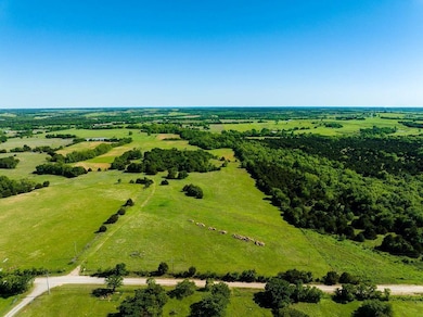 Birds eye view of property with a rural view
